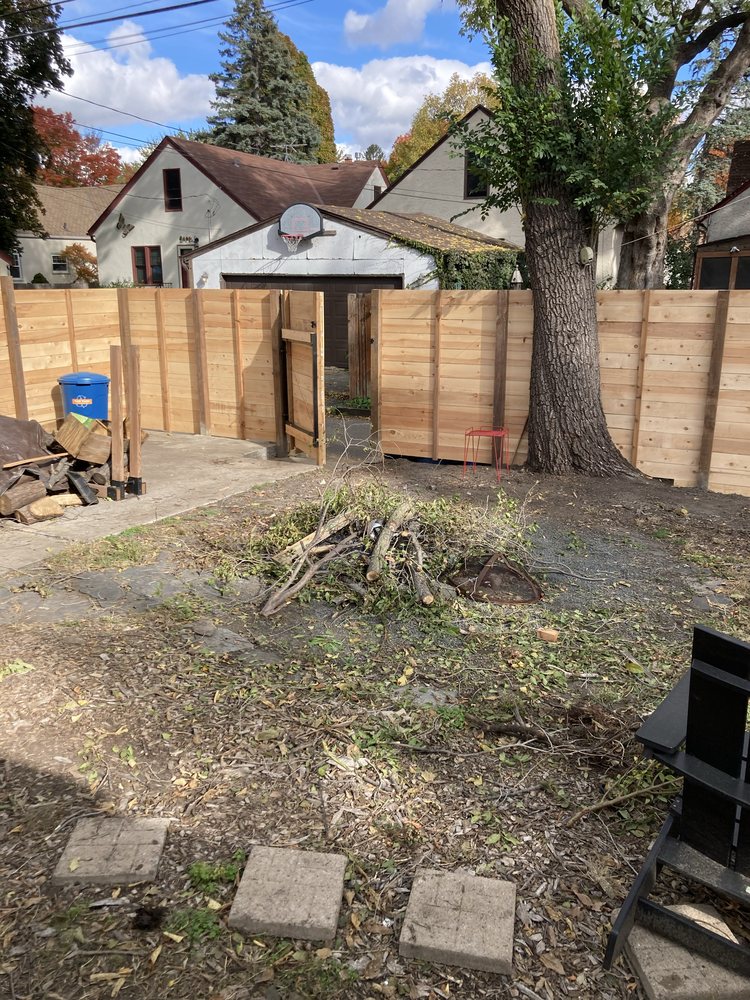 Finished cedar privacy fence and walk gate in a Minneapolis backyard